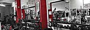 Racks of dumbbells and benches